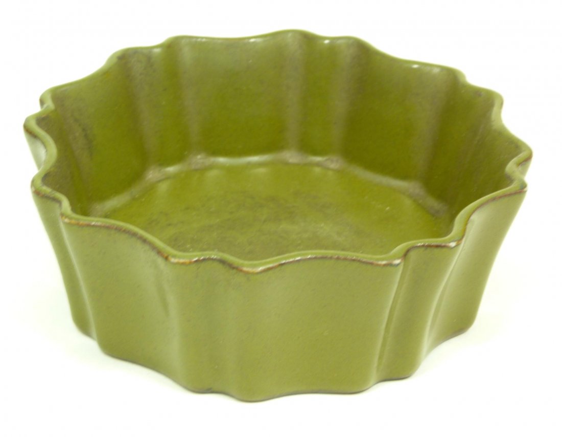 18th C CHINESE OLIVE GREEN PORCELAIN BOWL: Antique Chinese Qing Dynasty olive green porcelain bowl. Has a scalloped design with flaring sides. Holds impressed Qianlong (1736-1795) six character archaic reign marks to bottom. Measures 1 1/2" he