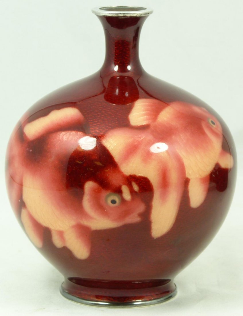 JAPANESE ENAMLELED GUILLOCHE KOI FISH GOURD VASE: Japanese enameled guilloché metal vase depicting two koi fish with a red ground. Has silvered metal bands encasing rim and foot. Among the quality of Ando Jubei. 19th/20th century. Measures 5 3/4" he
