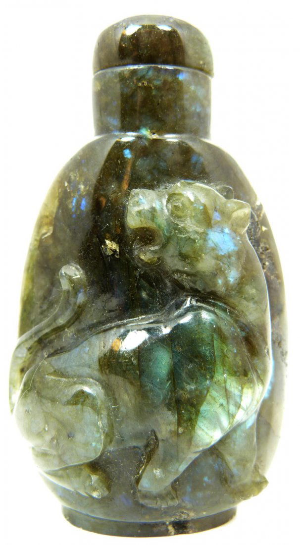 19th/20th CHINESE LABRADORITE SNUFF BOTTLE: Antique Chinese hand carved Labradorite snuff bottle depicting seated lion figure. 19th/20th century. Measures 3" height (7.6cm). Total weight of 99 grams.