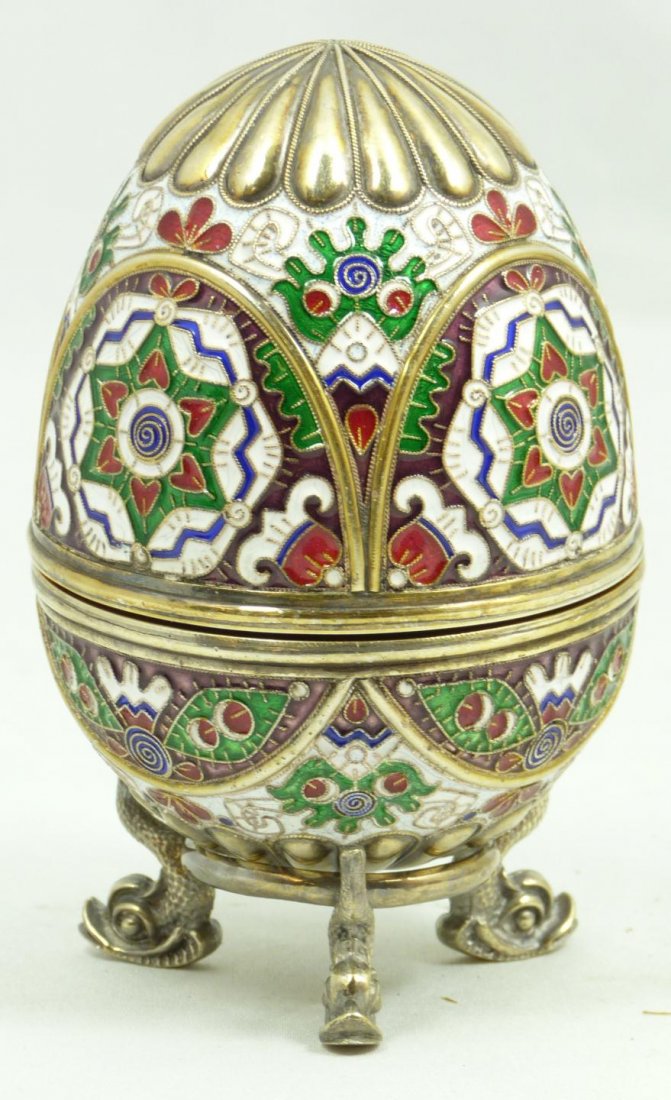 RUSSIAN SILVER ENAMELED EGG WITH STAND: Finely crafted Russian silver egg with multicolor enameled design throughout. Has Cabochon citrine to bottom. Holds Imperial Warrant marks, town marks, 84 silvery purity marks and Feodor Ruckert Cyril