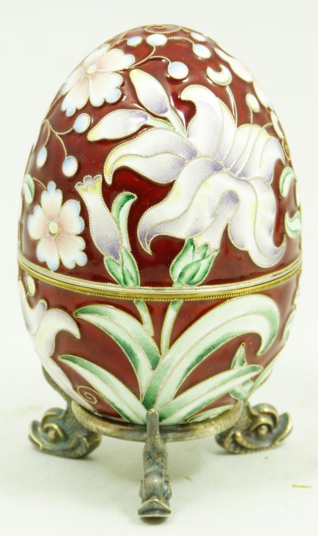 RUSSIAN ENAMELED SILVER FLORAL EGG w STAND: Incredible Russian silver egg. Has beautiful enamel floral design over rust ground. Gold wash interior. Has Double headed eagle mark and 88 silver purity mark. Has silver footed stand with figural fis
