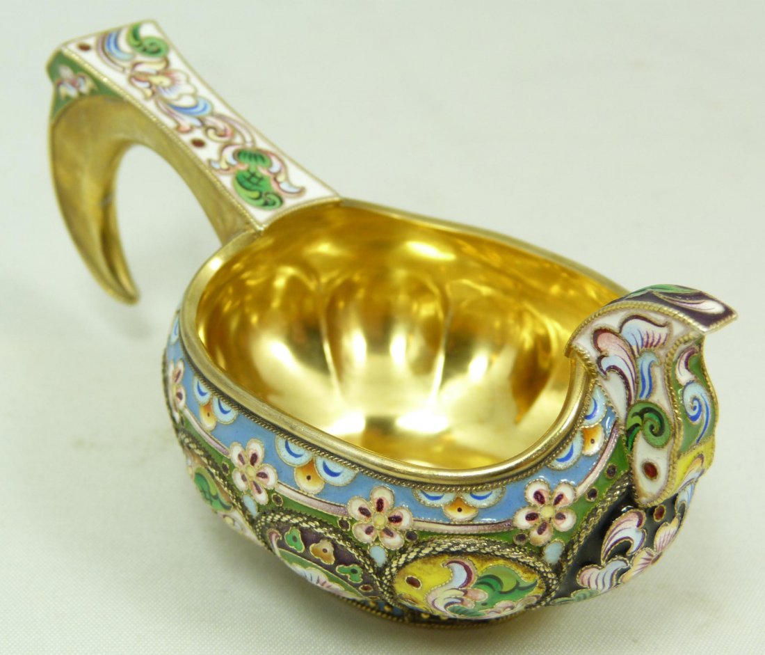 RUSSIAN ENAMELED SILVER KOVSH: Imperial Russian silver kovsh. Beautifully decorated throughout with vivid multicolor enamel design. Gold wash Interior. Bottom holds 84 silver purity and town marks. Holds Grachev Brothers workmaster