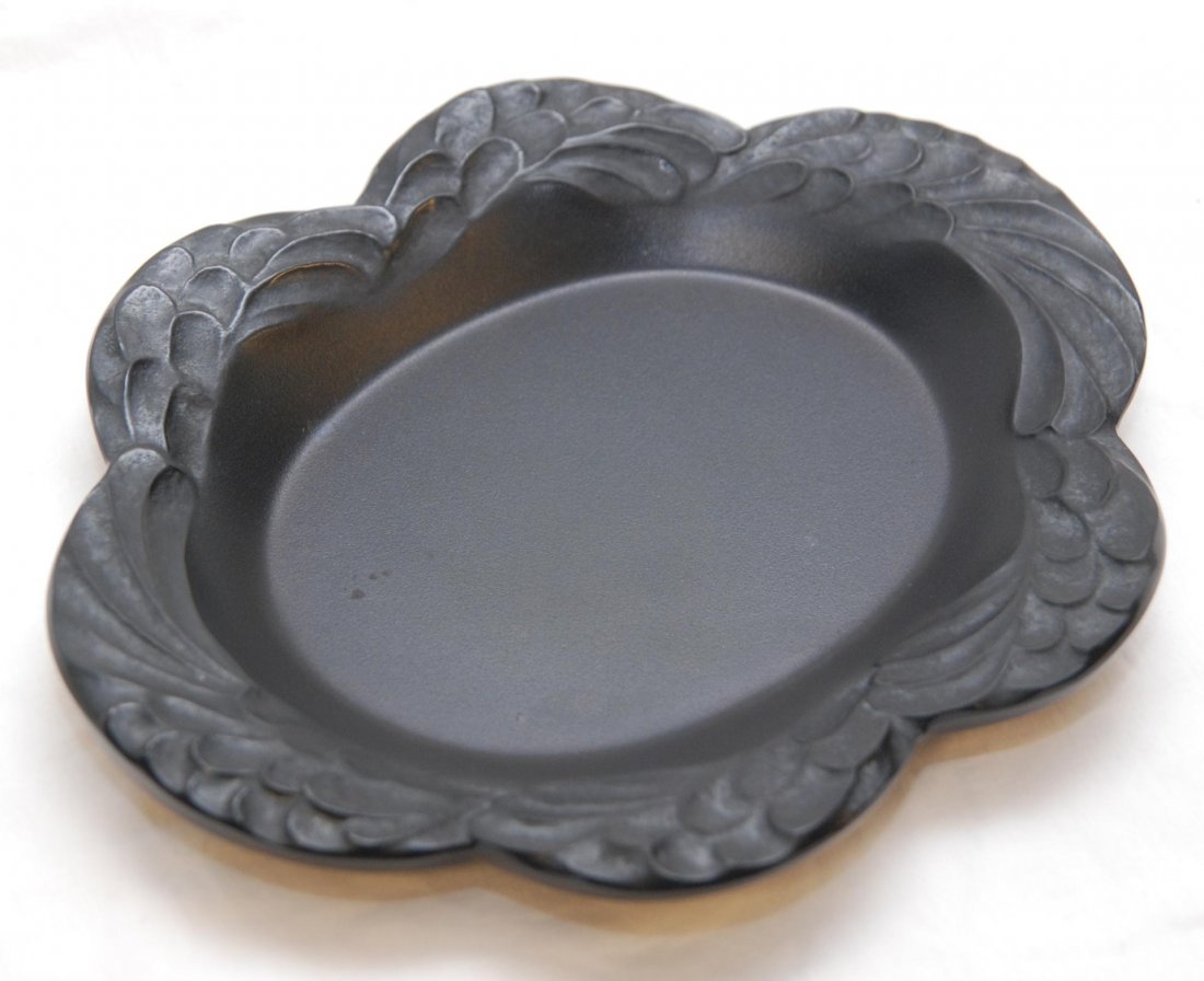 LALIQUE FRANCE BLACK CRYSTAL LAURE PLATE: Lalique French black crystal Laure plate. Has an oval shape with feathers design to borders and scalloped rim. Etched Lalique France mark to bottom. Measures 11" length x 9" width (27.9cm x 22.8cm). T