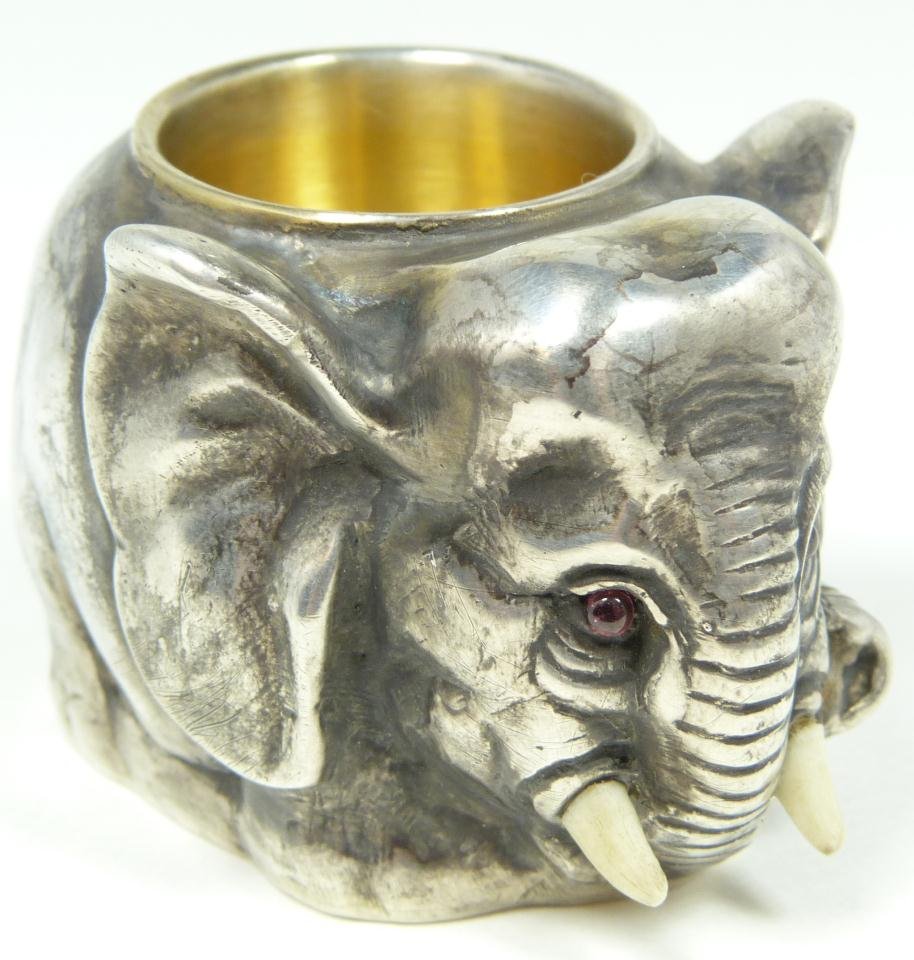 RUSSIAN SILVER ELEPHANT SALT CELLAR: Russian silver standing elephant figural salt cellar having Cabochon cut pink sapphire stones set to eyes. Has town marks and 84 silver purity marks to bottom. Also holds Julius Rappoport's "I.P." wor