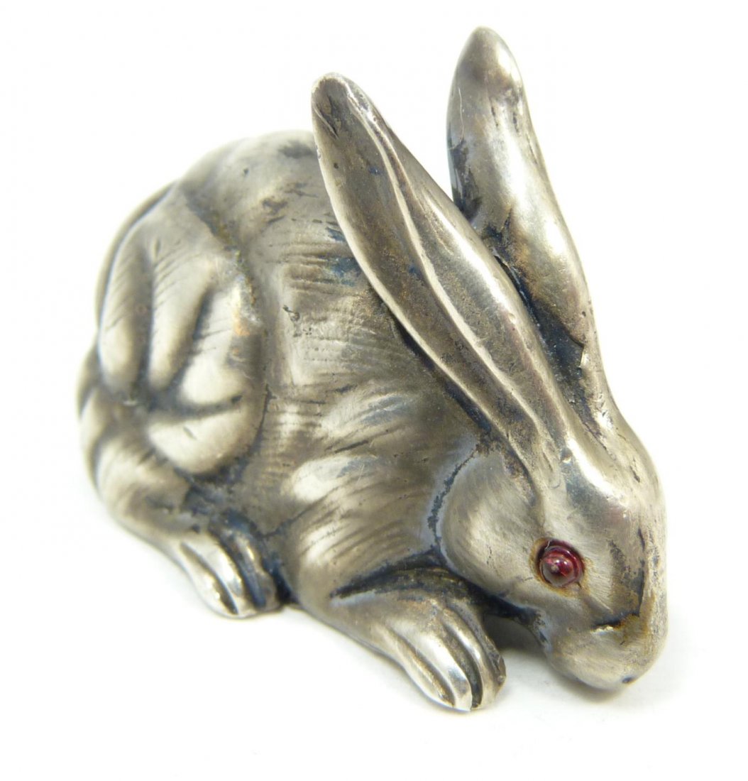 RUSSIAN SILVER SEATED RABBIT FIGURE: Russian solid silver rabbit figure. Cabochon cut ruby jewels set to eyes. Has town marks and 84 silver purity marks to bottom. Also holds Julius Rappaport Cyrillic workmaster mark to bottom. Also hold