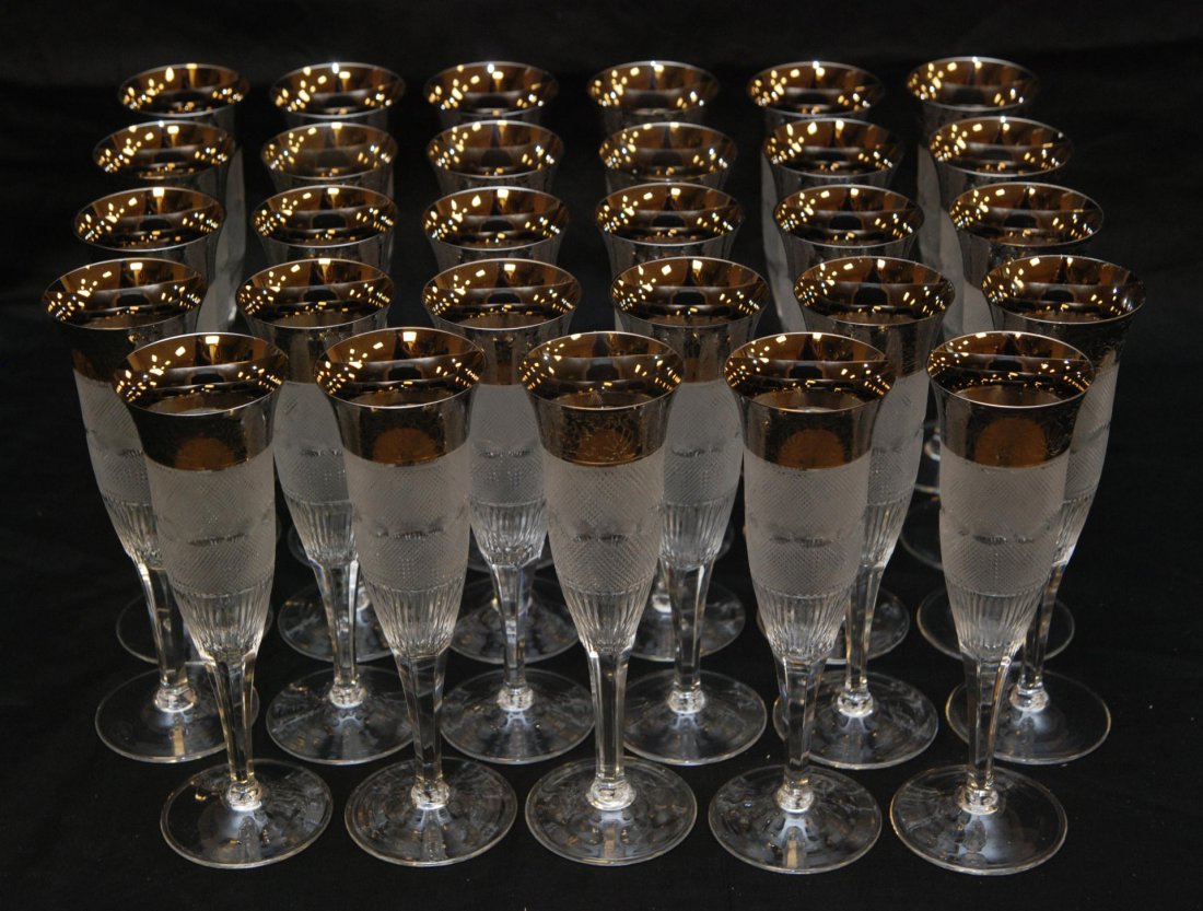 29 MOSER CRYSTAL SPLENDID CHAMPAGNE FLUTES: 29 Moser Czech crystal champagne flutes in the 'Splendid' pattern. Each having a fine diamond matrix design with oval cuts to center. Platinum overlay design to rim. Has Moser watermark to foot. Measu