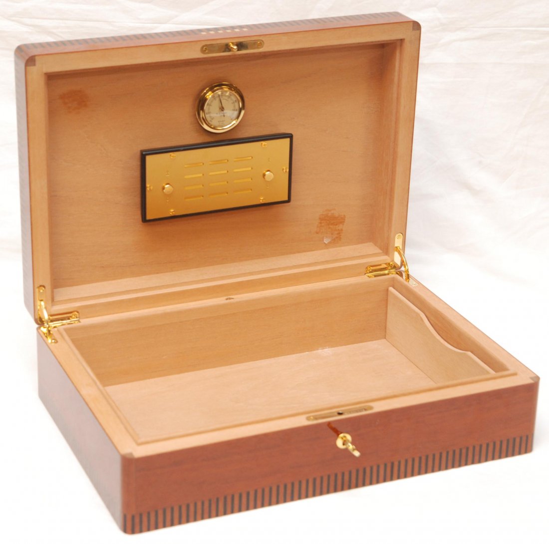 ELIE BLEU FRENCH LACQUERED WOOD CIGAR HUMIDOR: Elie Bleu French cigar humidor box. Constructed of wood with ebony pinstripe inlay design completed with heavy lacquer. Has locking mechanism to front of box with original key. 20th century. Measures