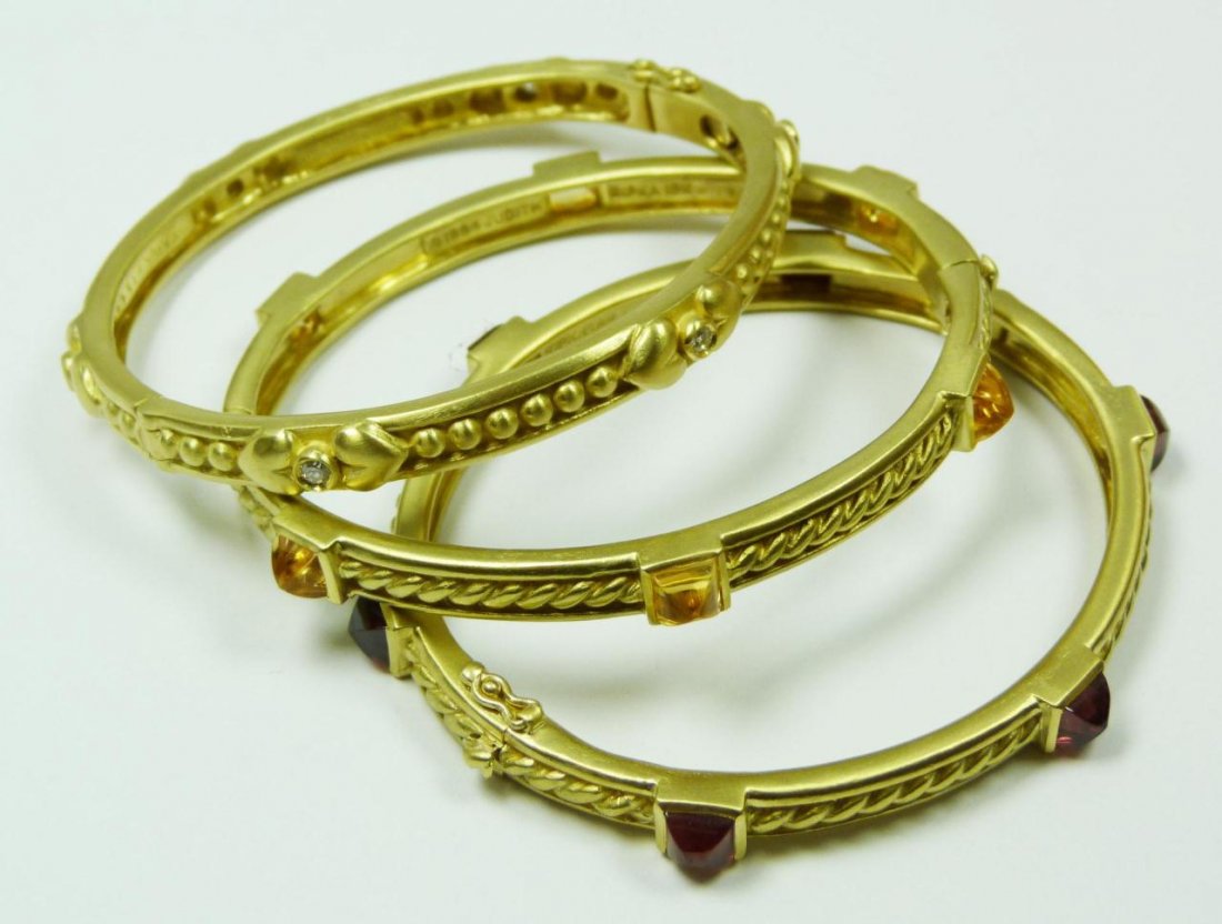 3 RIPKA 18K YG DIAMOND CITRINE RUBY BRACELETS: 3 Judith Ripka 18k yellow gold bangle bracelets holding diamond approx. 0.30ctw., citrine approx. 2.58ctw. & ruby approx. 2.58ctw. Each signed and dated 1994 in inside. Each fits wrist approx. 2 1/4"