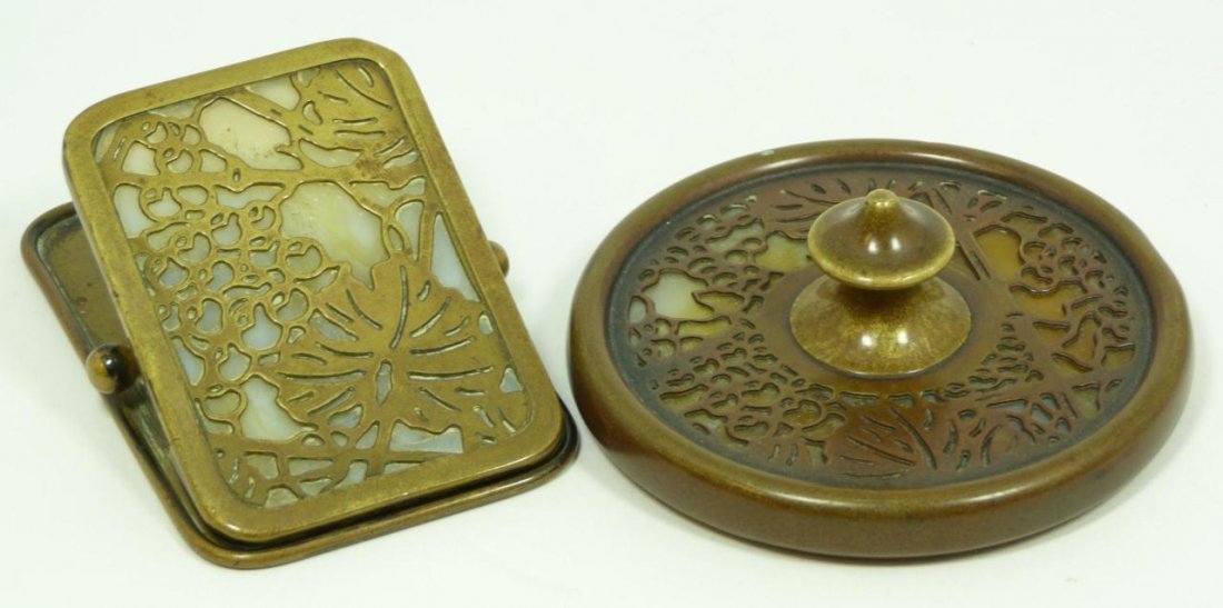 TIFFANY STUDIOS BRONZE PAPERWEIGHT & CLIP: Tiffany Studios bronze and glass paperweight and clip desk set. Both pieces marked 'TIFFANY STUDIOS NEW YORK'. The paperweight marked 936 and the clip marked 971. Early 20th century. Paper weight meas