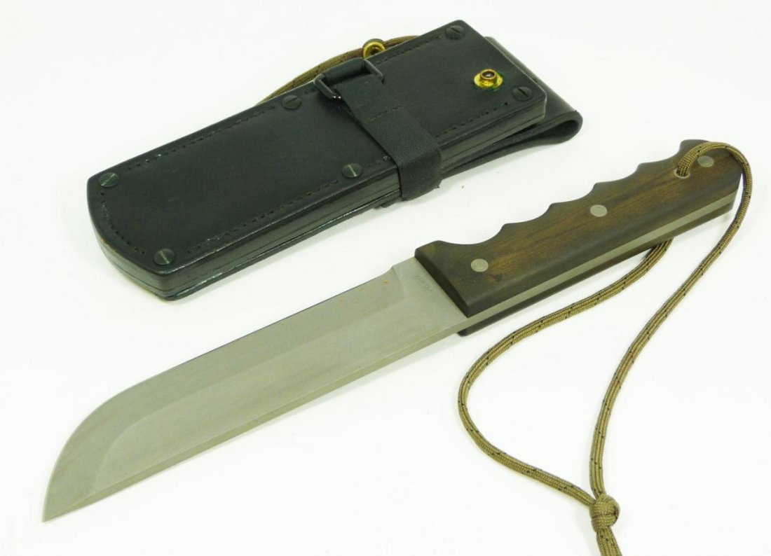 MARV PALMER CUSTOM HEAT TREATED BOWIE KNIFE: Marv Palmer custom heat treated bowie knife with sheath. Straightback blade with Micarta handle. Measures 12" length (30.5cm). Blade measures 6 5/8" length (16.8cm).