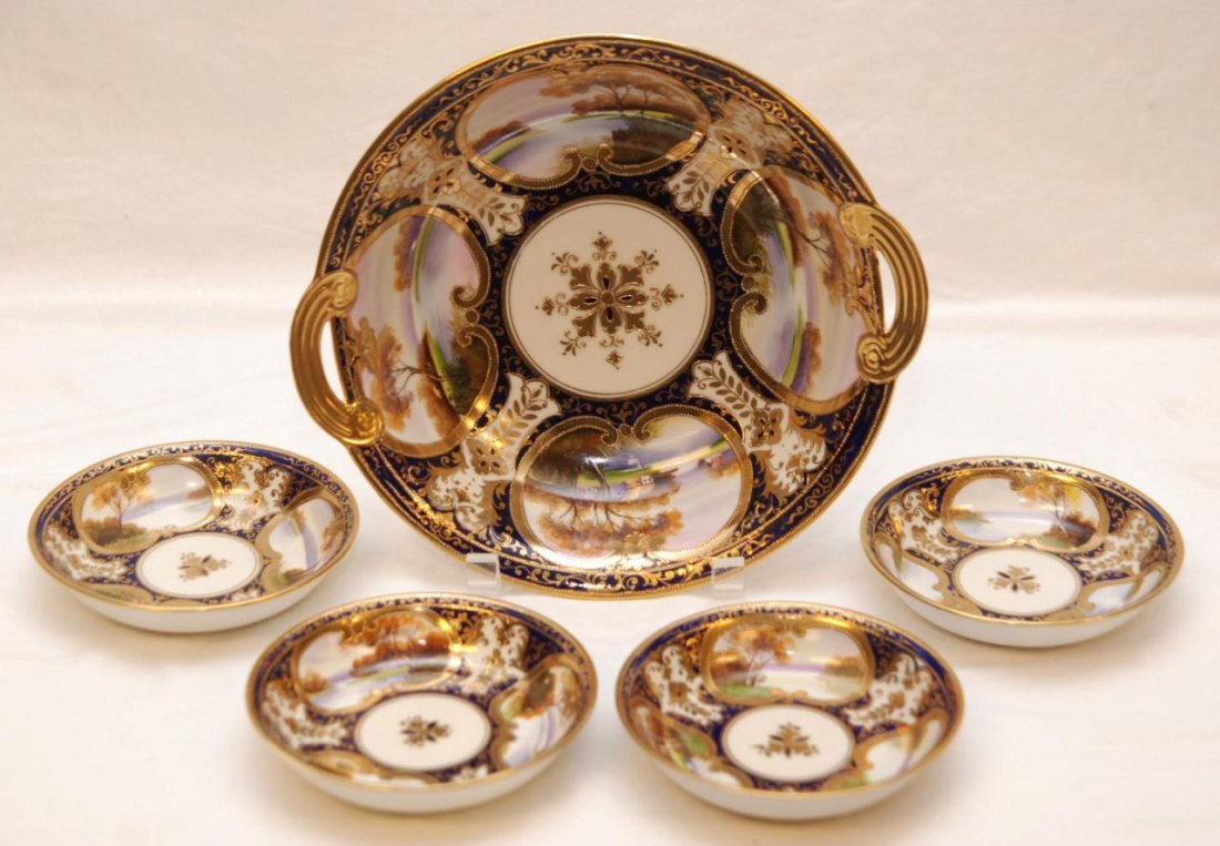 5 NORITAKE HAND PAINTED COBALT DISHES: 5 piece set of Noritake Japanese hand painted porcelain dishes having a European design depicting landscape scenes with ivory and cobalt border design. Hand painted gilt design throughout. Lot include