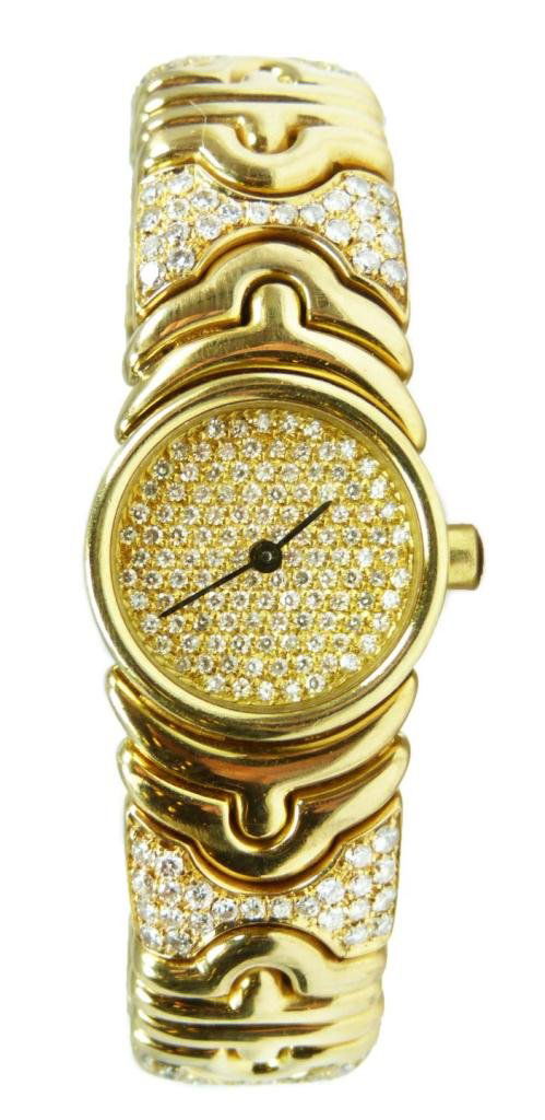 BVLGARI 18K DIAMOND PARENTHESES WATCH: Bulgari 18k yellow gold and diamond Parentheses or 'Parentesi' bangle watch. The bangle of fancy-shaped links featuring a round dial pave-set with single-cut diamonds, the bracelet accented with 192 r