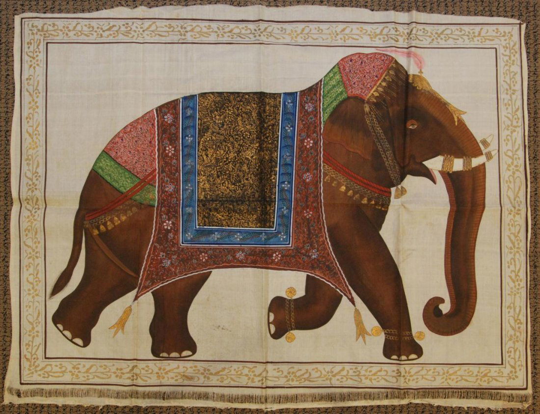 18th/19th CENTURY INDIAN OIL PAINTING ON SILK: Antique Indian hand painted oil on silk depicting a decorated standing elephant with tusk forward and trunk down. He is draped with woven ceremonial saddle and wearing golden anklets. Also has golden