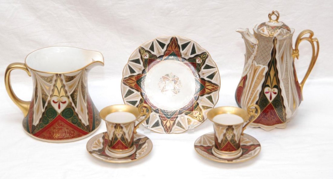 7pc ALHAMBRA PATTERN AUSTRIAN COFFEE SERVICE: Consisting of; one lidded coffee pitcher, one water pitcher, one plate, and two cups & saucers. The largest pieces measuring 10.5" tall.