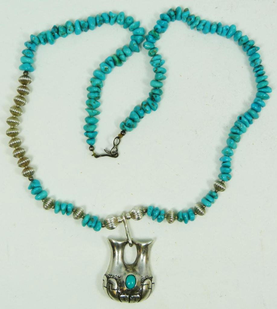 A. SUES SOUTHWET STERLING & TURQUOISE NECKLACE: Measures approx. 24" long, with many Turquoise chunks and 17 Sterling spacers.