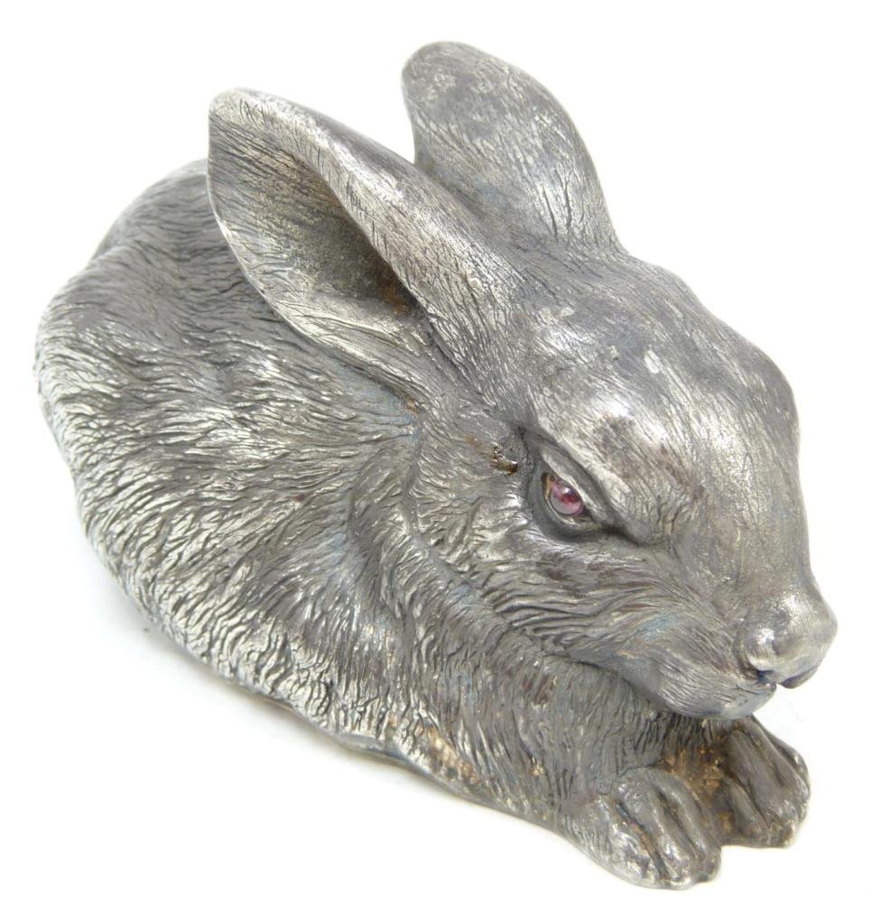 RUSSIAN SILVER SEATED RABBIT FIGURE: Russian silver rabbit figure. Cabochon cut ruby jewels set to eyes. Has town marks and 88 silver purity marks to bottom. Also holds Julius Rappaport Cyrillic workmaster mark to bottom. Measures 2" hei