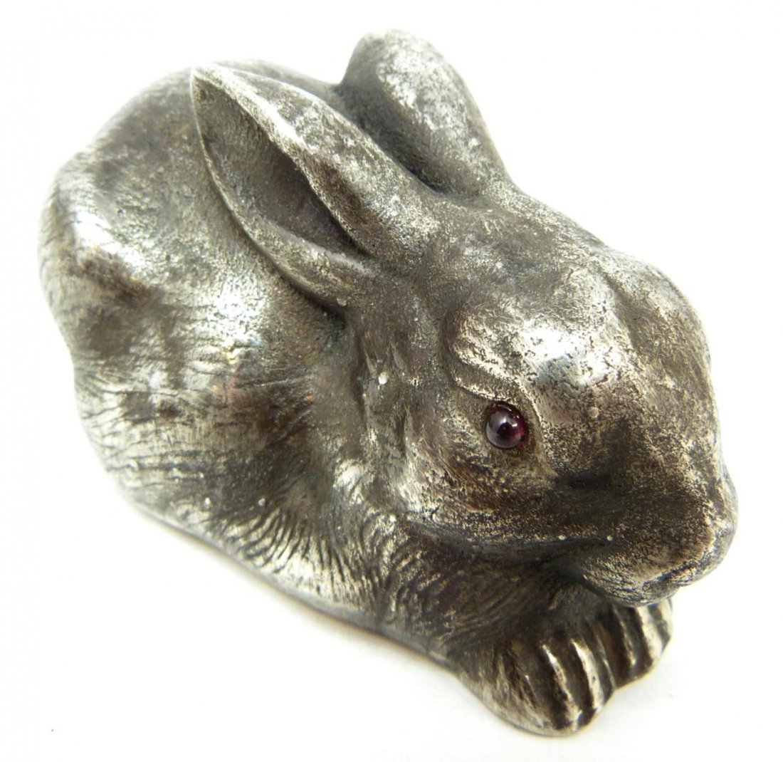RUSSIAN SILVER SEATED RABBIT FIGURE: Russian silver rabbit figure. Cabochon cut ruby jewels set to eyes. Has town marks and 88 silver purity marks to bottom. Also holds Julius Rappaport Cyrillic workmaster mark to bottom. Measures 1 1/2"