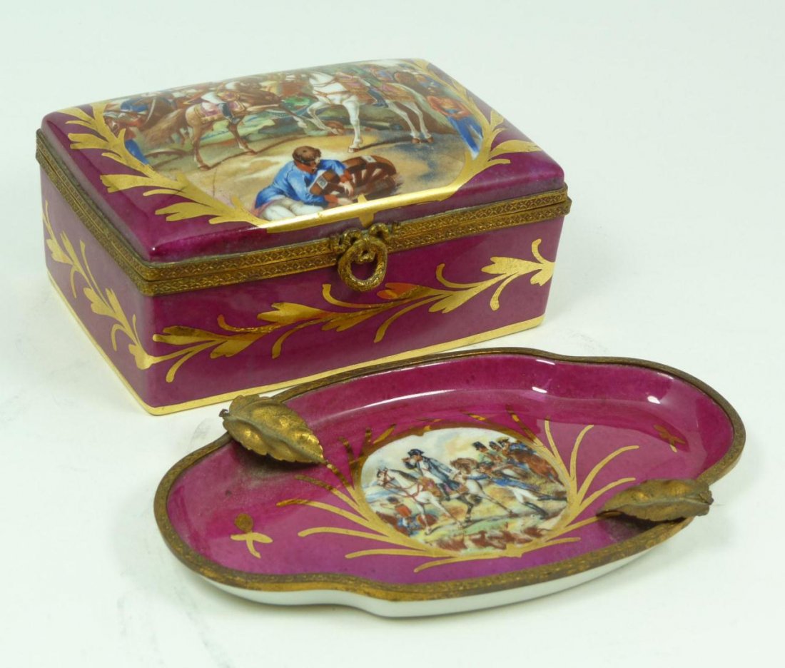 2 FRENCH LIMOGES NAPOLEON SCENE PORCELAIN ITEMS: A lot of 2 antique French Limoges items. Each having a Napoleon Bonaparte scene with hand painted accenting. Lot includes a hinged trinket box and oval dish having metal rim and leaf design. Each hold