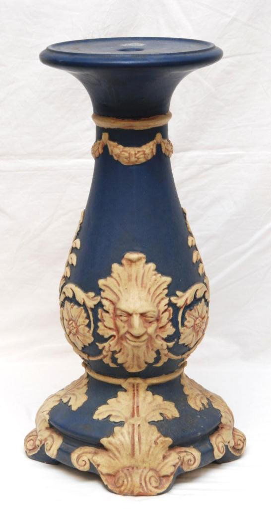 ANTIQUE EUROPEAN POTTERY FIGURAL FACE PEDESTAL: An antique European pottery pedestal having a figural face design with floral scrolled leaves and floral garlands. 19th century. Measures 20 1/2" height (52cm). Total weight of 7.8 kilograms.
