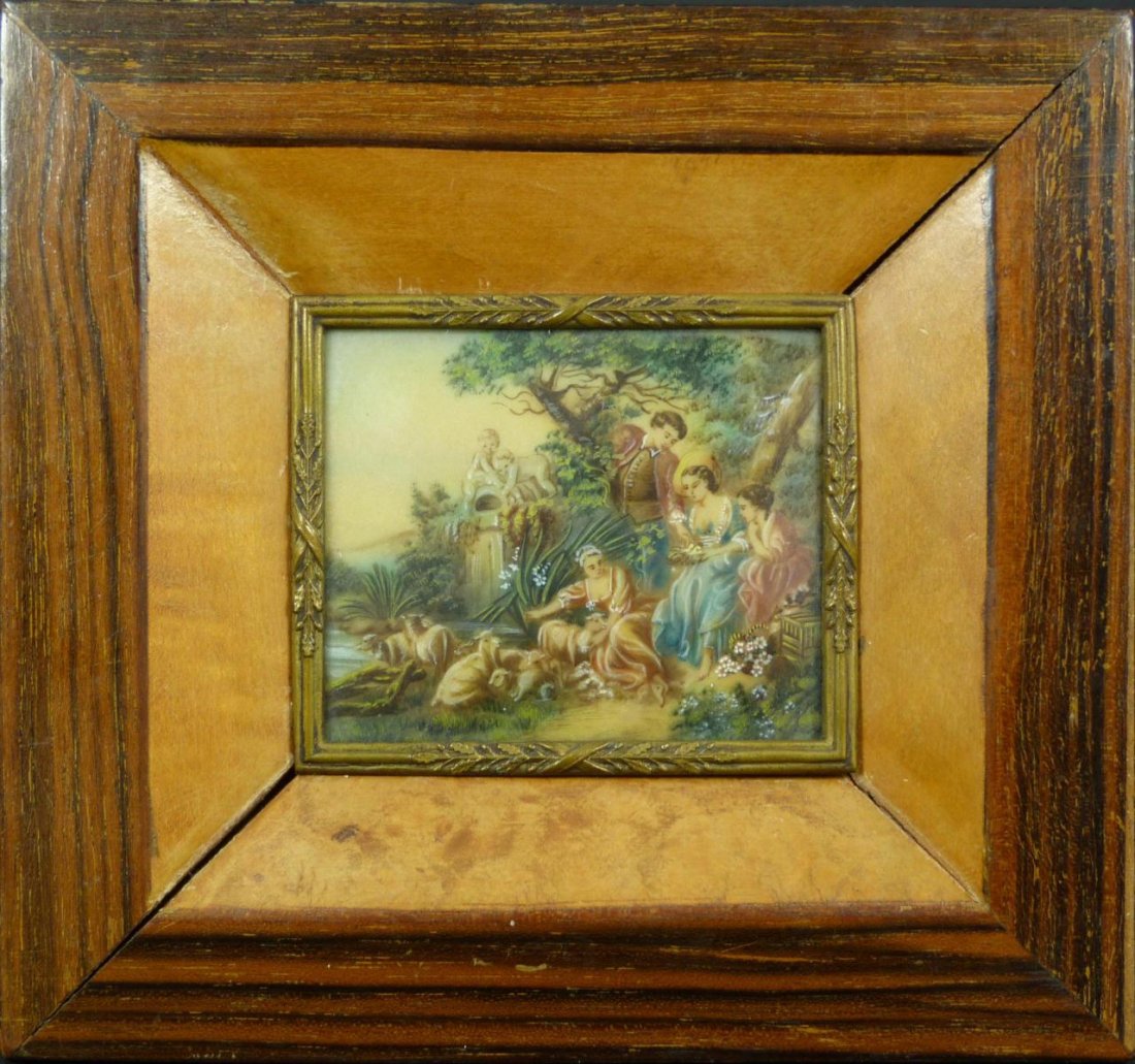 ANTIQUE OIL PAINTING ON IVORY CONTINENTAL SCENE: An antique Continental hand painted oil on ivory plaque depicting a man with 3 women. He has presented them with birds and sheep can be seen nearby. Mounted in burlwood frame with bronze mount around 