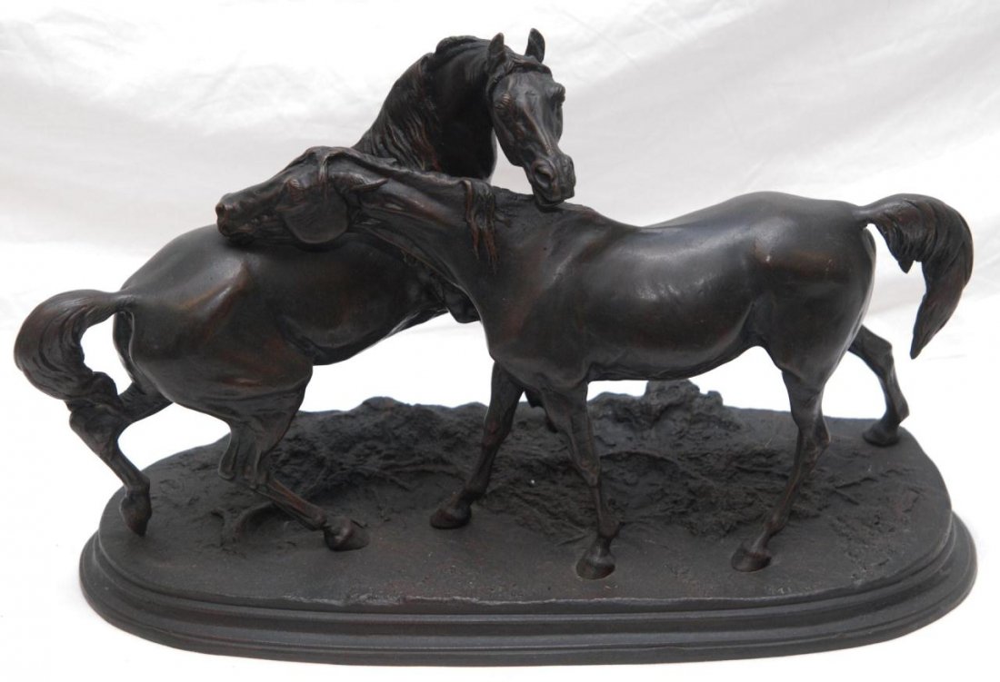 PIERRE JUES MENE BRONZE OF TWO HORSES (AFTER): A bronze figure depicting two horses standing on earth form base after Pierre Jules Mène (FRENCH, 1810-1879). Signed 'PJ MENE' to base. Measures 13 1/2" height x 21 1/4" length x 9 1/4" depth (34.2cm