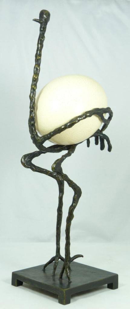 AFTER GIACOMETTI 'L'AUTUCHRE' BRONZE SCULPTURE: Bronze sculpture holding ostrich egg after Diego Giacometti (SWISS, 1902-1985) titled 'L'Autruche'. Measures 19 5/8" height (49.8cm). Total weight of 3.28 kilograms.
