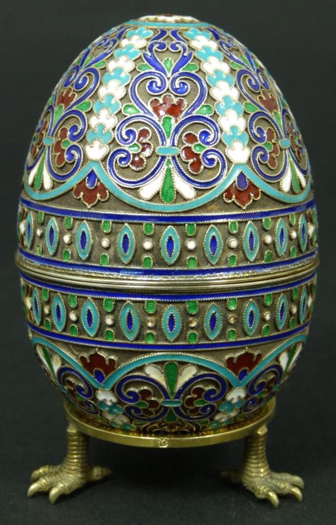 RUSSIAN SILVER ENAMELED SCROLLED EGG BOX: Finely crafted Imperial Russian silver egg with multicolor enameled scrolled design throughout. Holds 84 silver purity marks, town marks, and Cyrillic work master marks. Marked to interior of both sid