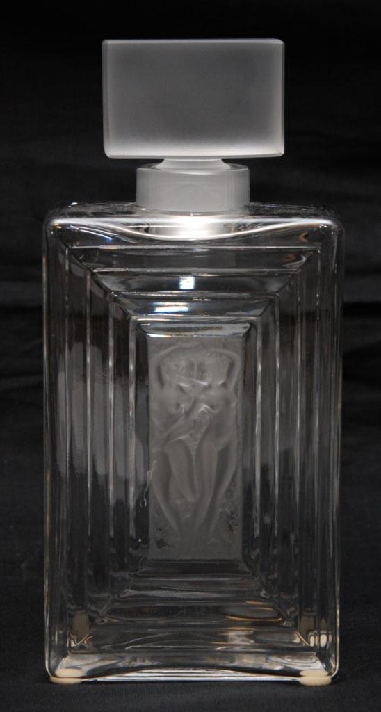 LALIQUE CRYSTAL 'DUNCAN No. 2' PERFUME BOTTLE: A Lalique French crystal 'Duncan No. 2' perfume bottle having a clear and frosted design depicting two dancing nudes. Holds 'Lalique France' etched signature to bottom. Measures 7 7/8" height x 3 5/8"