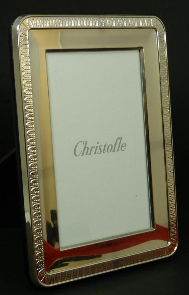 CHRISTOFLE FRANCE STERLING SILVER PICTURE FRAME: A Christofle French sterling silver picture frame with leaf border design. Includes original presentation box. Measures 8" height x 6" width (20.3cm x 15.2cm). Holds image approx. 5 3/4" height x 3 3/