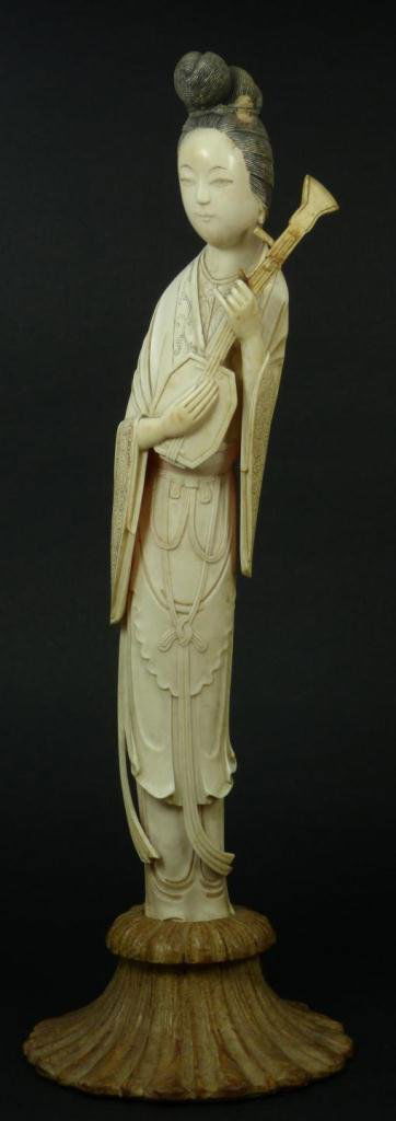 CHINESE CARVED IVORY MAIDEN WITH MANDOLIN: An antique Chinese carved ivory maiden holding a mandolin. She is wearing layered robe with chased patterns. Mounted on fitted wooden base. Mid to late Qing dynasty period, 19th century. Measures 13 7