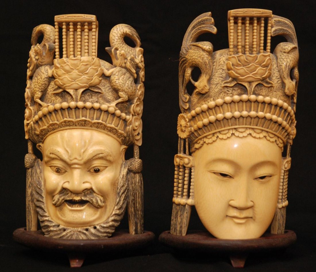 FINE CHINESE IVORY EMPEROR & EMPRESS BUST PLAQUES: Pair of fine Chinese hand carved ivory face plaques depicting Emperor and Empress. Each intricately carved throughout with high detail. Emperor is depicted with beard and dragon head dress. Empress is