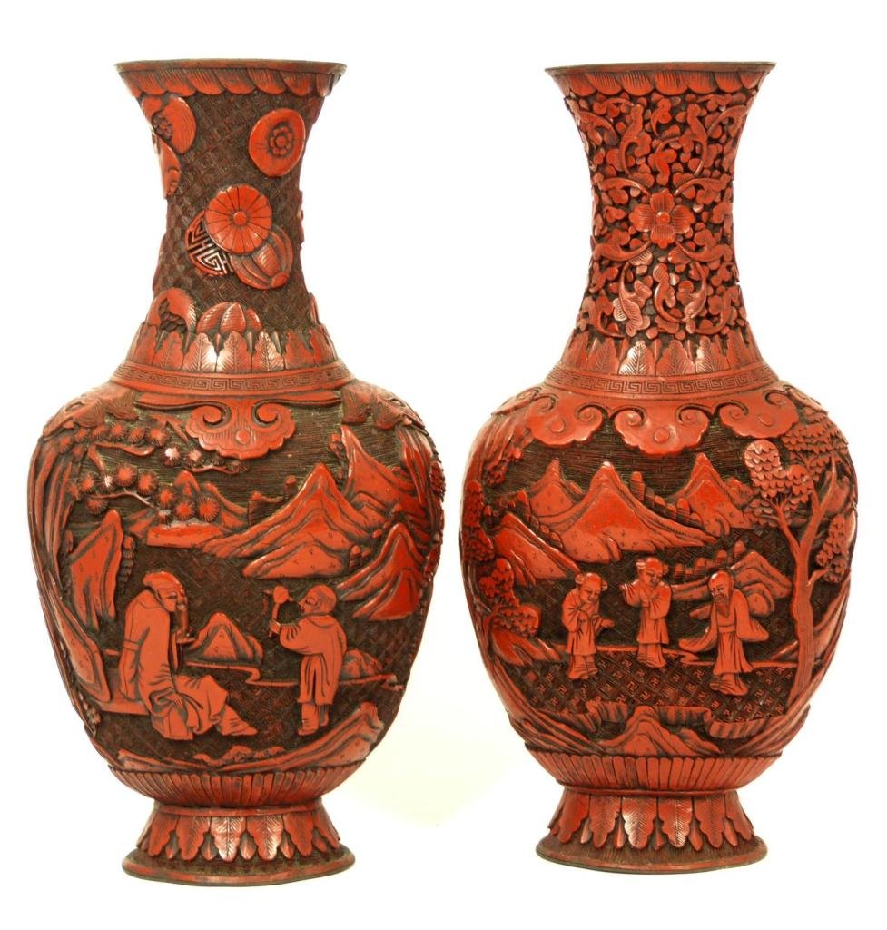 PAIR OF 19TH CENTURY CHINESE CINNABAR VASES: Pair of antique Chinese cinnabar red lacquered vases. Each having relief design depicting landscape mountainous scene with wisemen and attendants. Black lacquer interior and bottom. Mid to late Qing d