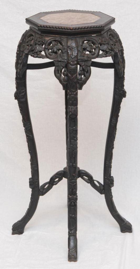 19th CENTURY CHINESE HARDWOOD MARBLE TOP TABLE: Antique Chinese hardwood marble top stand having reticulated floral design to sides. Beaded octagonal top. Raised floral designs to the four legs. Octagonal marble insert to top. Mid to late Qing Dyna