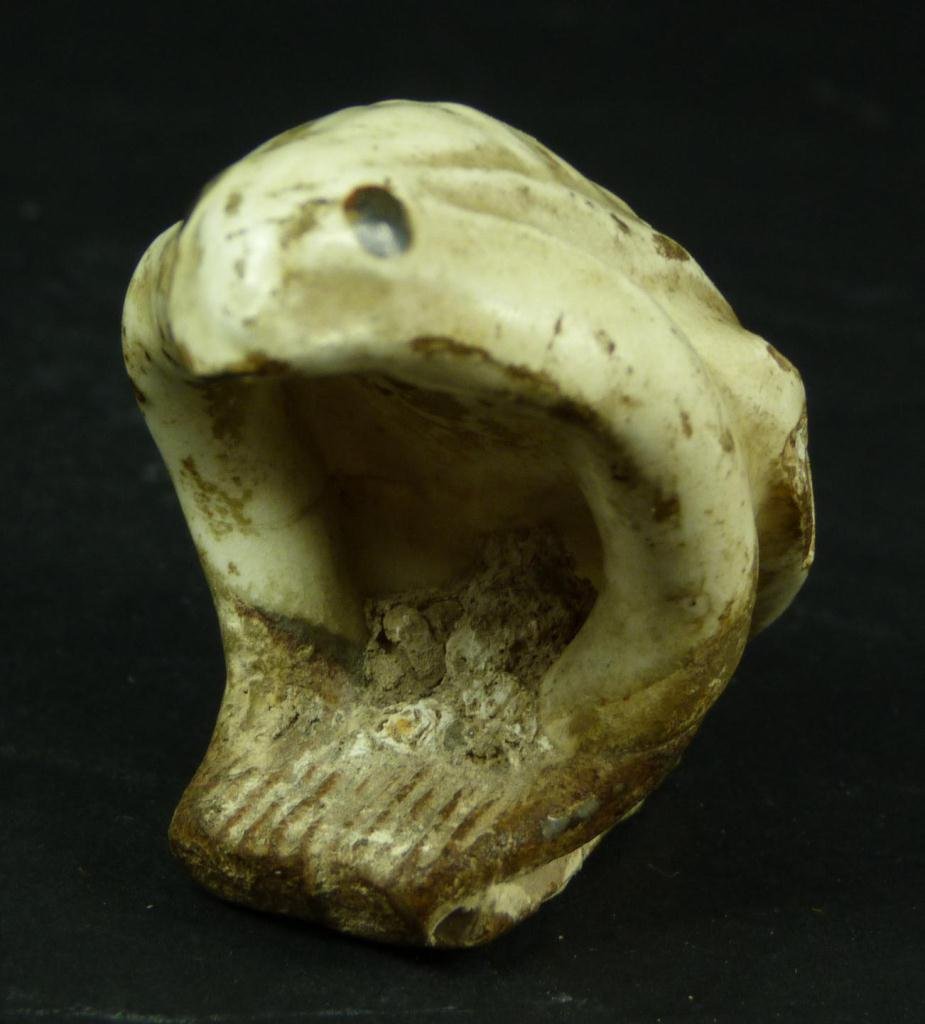 CHINESE HAND DYNASTY WHITE GLAZED POTTERY FROG: A Chinese Han Dynasty white glazed pottery figural frog. Measures 1 3/4" height x 2 3/8" length (4.4cm x 6cm). Total weight of 54 grams.