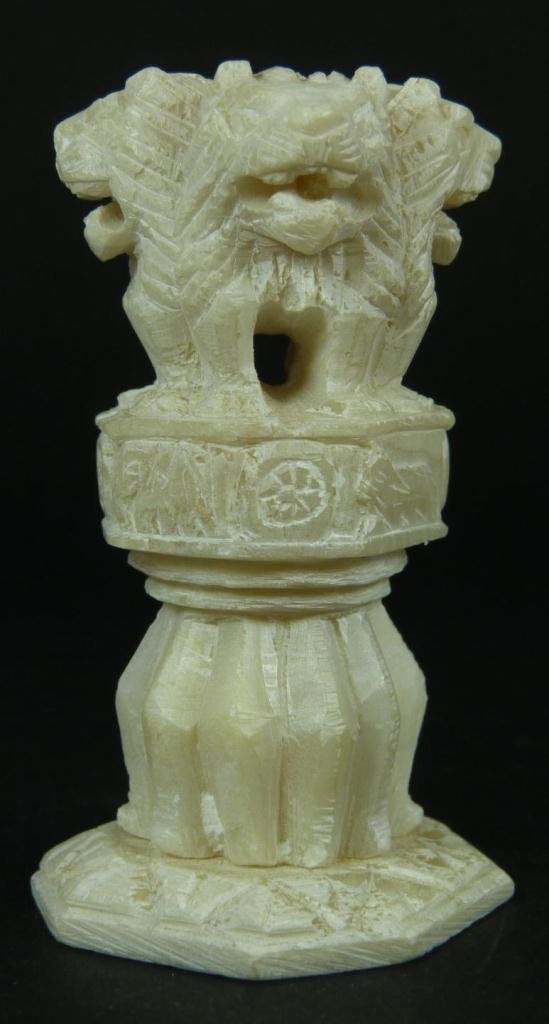 A CHINESE CARVED ALABASTER LIONS SEAL: Indian white alabaster stone seal depicting four lions, the national symbol. 19th/20th century. Measures 3 1/8" height x 1 3/4" length x 1 3/4" depth (7.9cm x 4.4cm x 4.4cm). Total weight of 156 grams