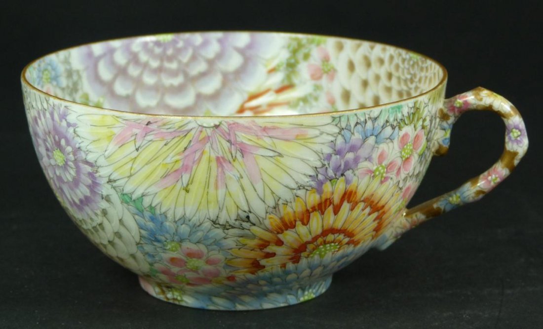 AN 18th C IMPERIAL EGGSHELL PORCELAIN TEA CUP: An antique Imperial hand painted eggshell porcelain tea cup having a floral design throughout interior and exterior. Holds calligraphy marks to bottom. Early to mid Qing dynasty period. Measures 1 7/8