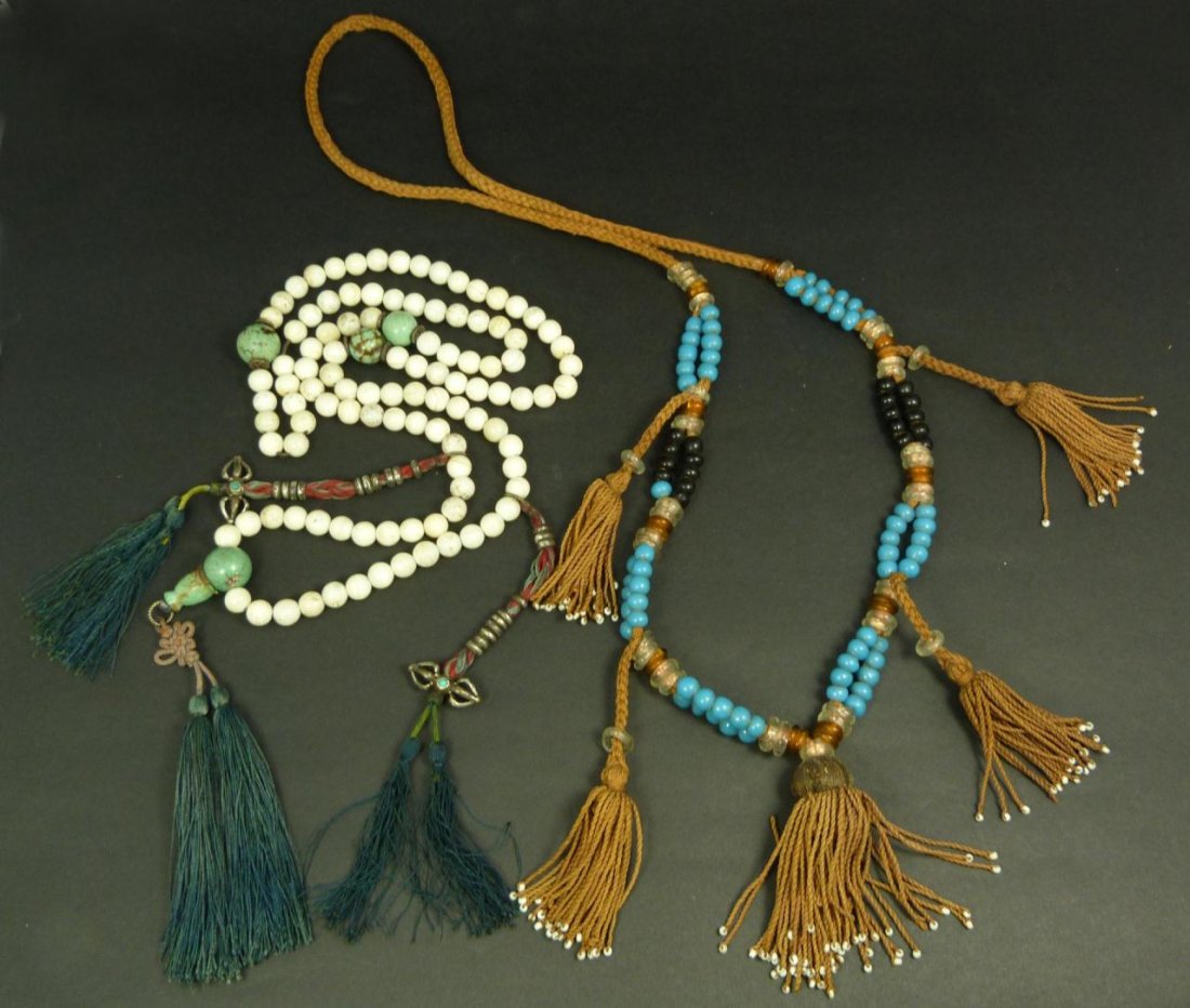 PAIR OF MANDARIN PORCELAIN COURT BEADS: Lot of two antique Mandarin court beaded necklaces comprised of porcelain and colored glass beads. Late Qing dynasty period. Longest measures approx. 49" length, including hanging tassel (124.4cm). To