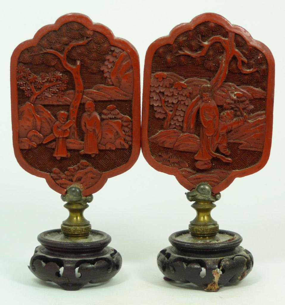 PR ANTIQUE CHINESE CARVED CINNABAR PANELS: One depicts Quan Yin and son. Other depicts an elder with his son. Each measures 10cm height + 5cm base. Total weight 150g.