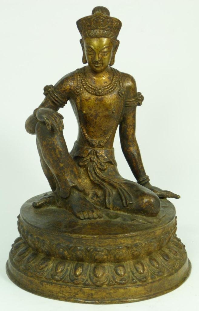 17th C BURMESE BRONZE SEATED BUDDHA IN ROYALEASE: Antique Burmese bronze figure depicting seated Buddha in Royalease on lotus blossom throne. Circa 17th century. Measures 10 1/8" height (25.7cm). Total weight of 2.74 kilograms.