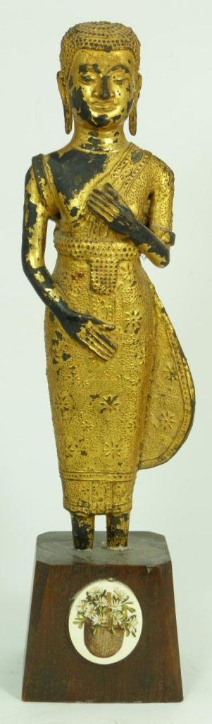 GILT LACQUERED BUDDHIST MONK W IVORY PLAQUE: Chinese gilded bronze Buddhist monk figure on wooden base. To front of base is an oval polychromed ivory plaque depicting flowers in basket. 18th/19th century. Measures 11 1/4" height + 2 7/8" base he