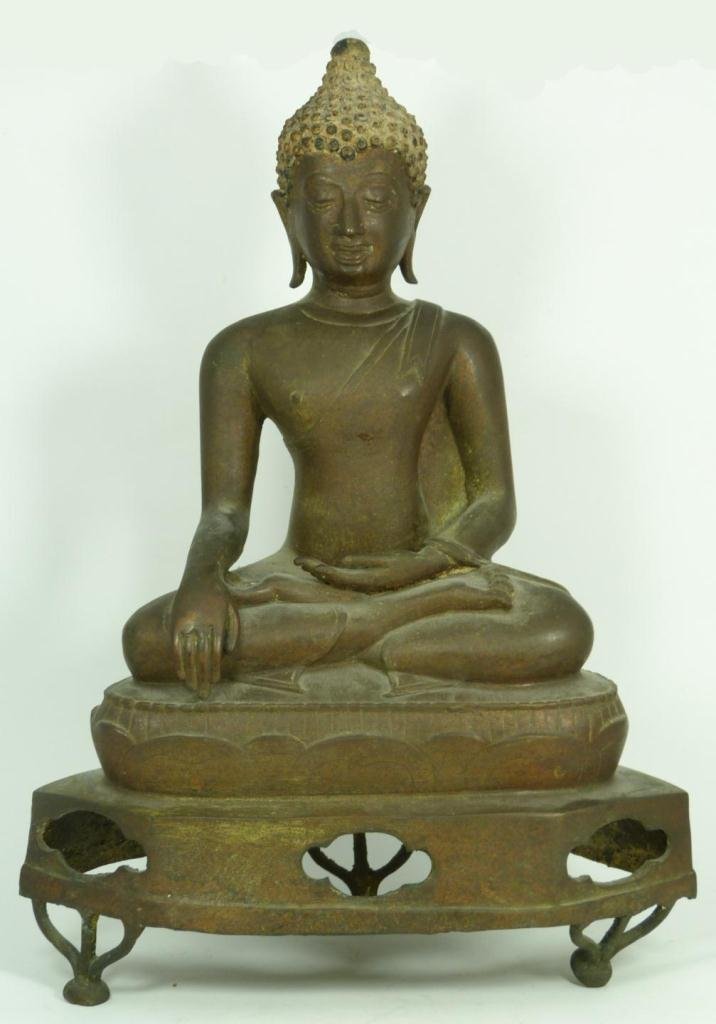18th CENTURY THAI BRONZE SEATED BUDDHA FIGURE: Antique Thai bronze seated Buddha. He is on stylized lotus blossom throne over reticulated tripod footed base. Circa 18th century. Measures 17 1/2" height x 12 1/4" width (44.4cm x 31.1cm). Total weig