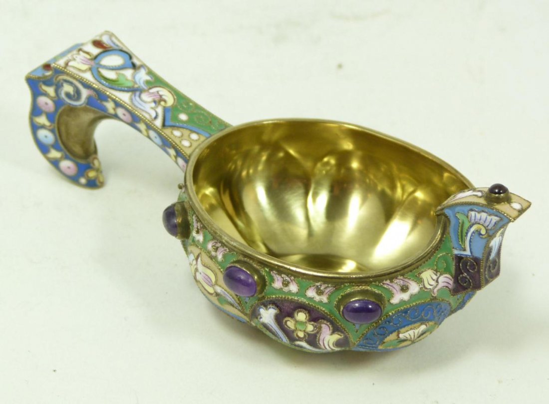 XLEBNIKOV RUSSIAN SILVER ENAMEL KOVSH w STONES: Beautifully decorated Russian silver and enamel kovsh. Has 6 oval cabochon cut sapphire jewels set throughout rim. Holds round cabochon cut ruby jewely to top of front of kovsh. Has the Moscow town ma