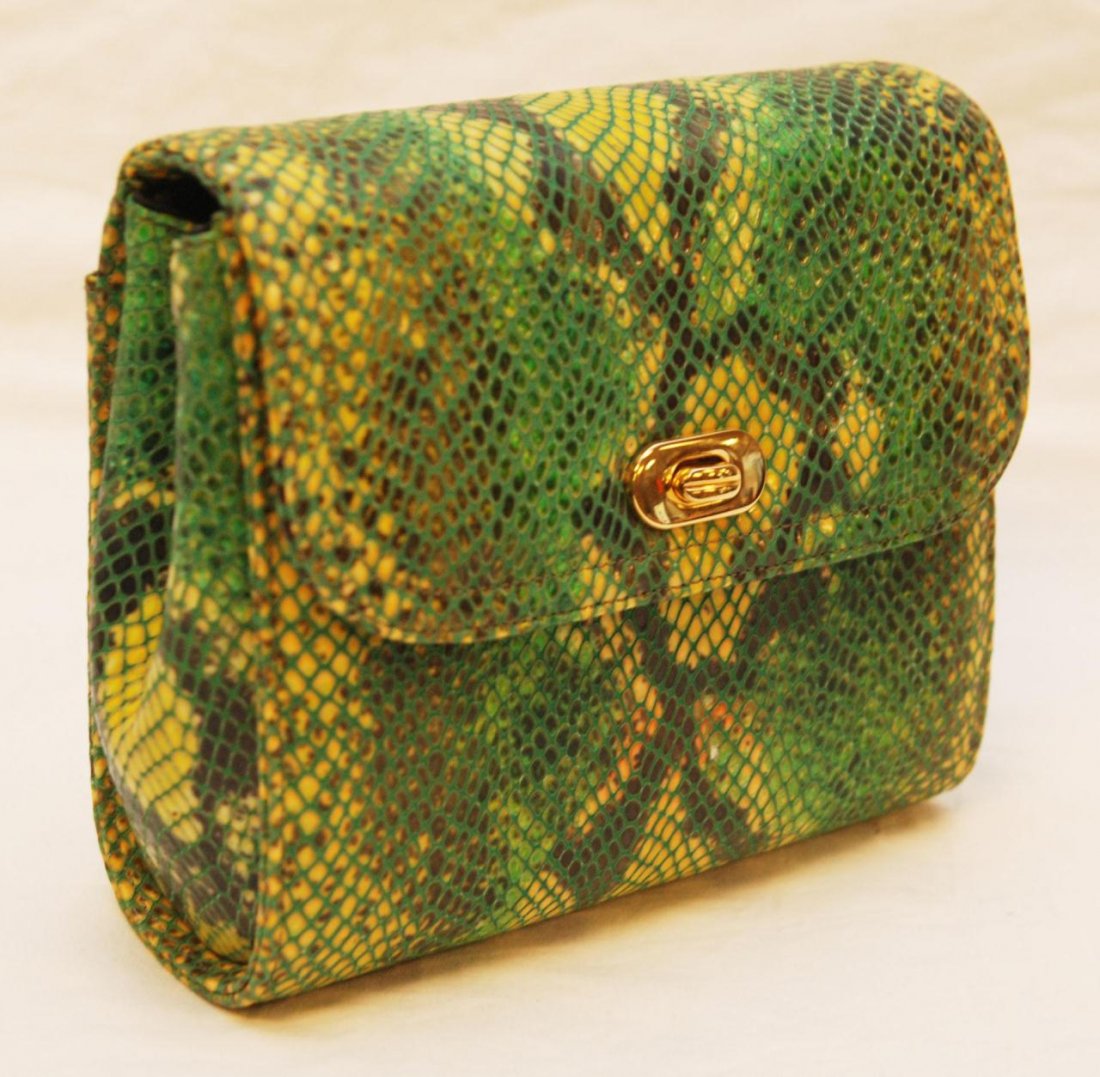 GREEN AND YELLOW SNAKE SKIN PURSE: Green and yellow snake skin purse with gold tone hardware. Black silk interior. Interior holds Theodore Label. Made in the USA. Measures 6" height x 7 1/2" width x 2 3/4" depth (15.2cm x 19cm x 6.9cm)