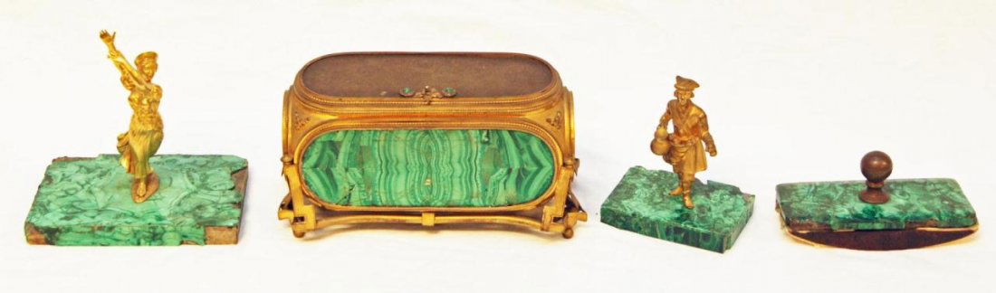 LOT OF OLD EUROPEAN MALACHITE AND BRONZE PIECES: Lot of old malachite and gilded metal pieces. Includes a footed rectangular box. Ink blotter with bronze handle. Also includes two standing figures on rectangular bases. Late 19th to early 20th centur