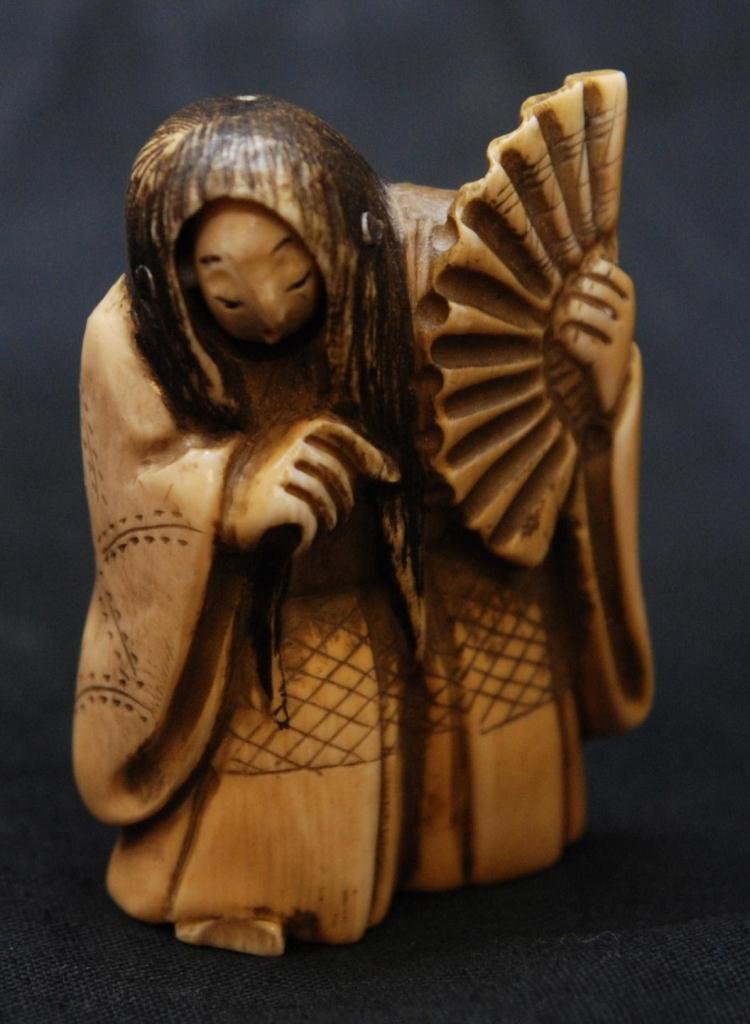 ANTIQUE JAPANESE 2 FACE KABUKI NETSUKE FIGURE: Antique Chinese hand carved ivory netsuke figure depicting a kabuki theatre actor with two faces. Signed to bottom. 19th century. Measures 2 1/4" height (5.7cm). Total ivory weight of 41.5 grams.