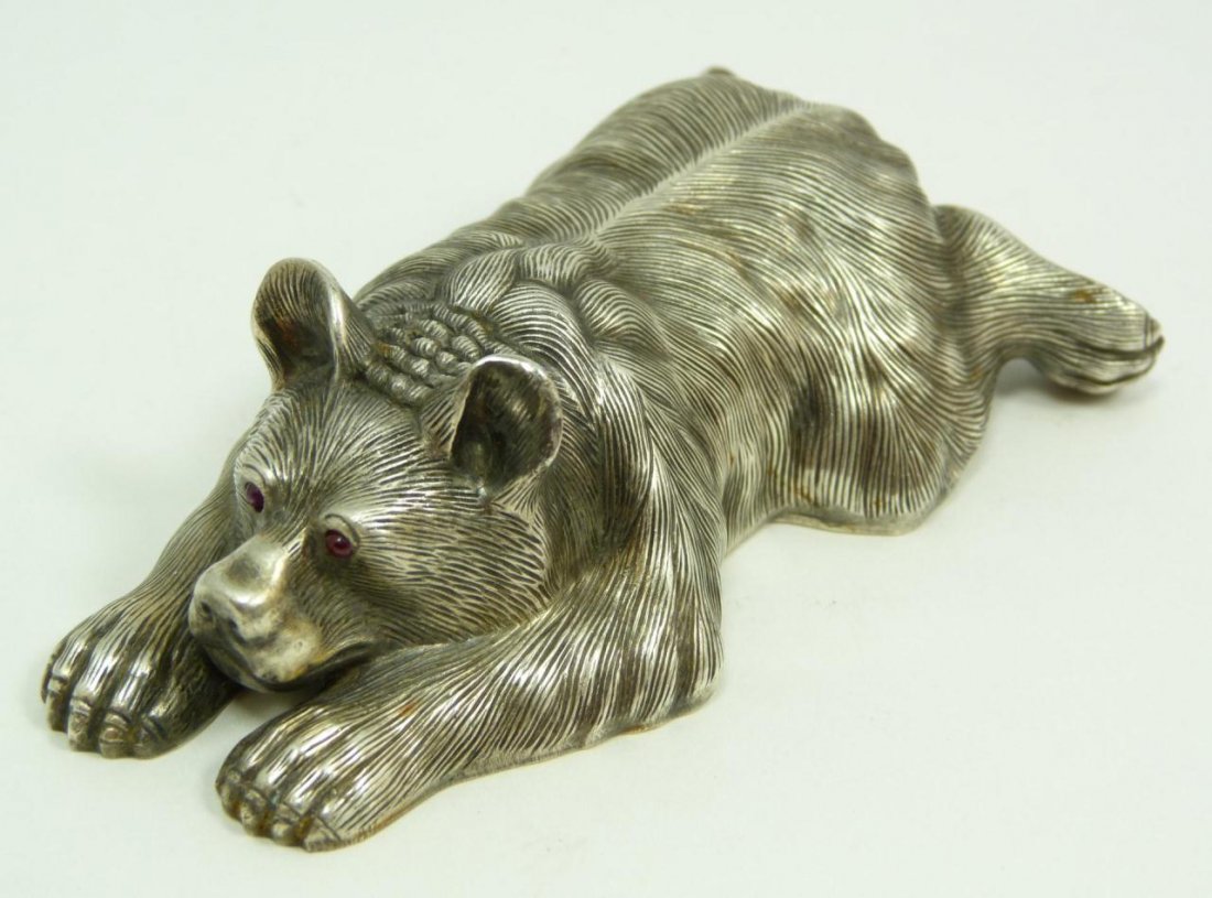 IMPERIAL RUSSIAN SILVER BEAR FIGURE w RUBY EYES: Russian silver recumbent bear figure with cabochon cut ruby stones set in eyes. Has town marks and 84 silver purity marks to bottom. Also holds Julius Rappoport's "I.P." workmaster mark to bottom. Mea