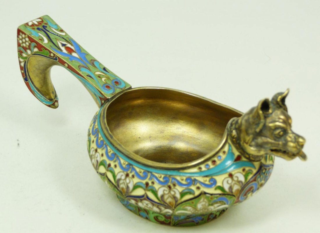 RUSSIAN ENAMELED SILVER FIGURAL WOLF KOVSH: Russian silver kovsh. Beautifully decorated throughout with vivid multicolor enamel design and figural wolf head to front. Gold wash Interior. Bottom holds Pavel Akimov Ovchinnikov work, 84 silver pur