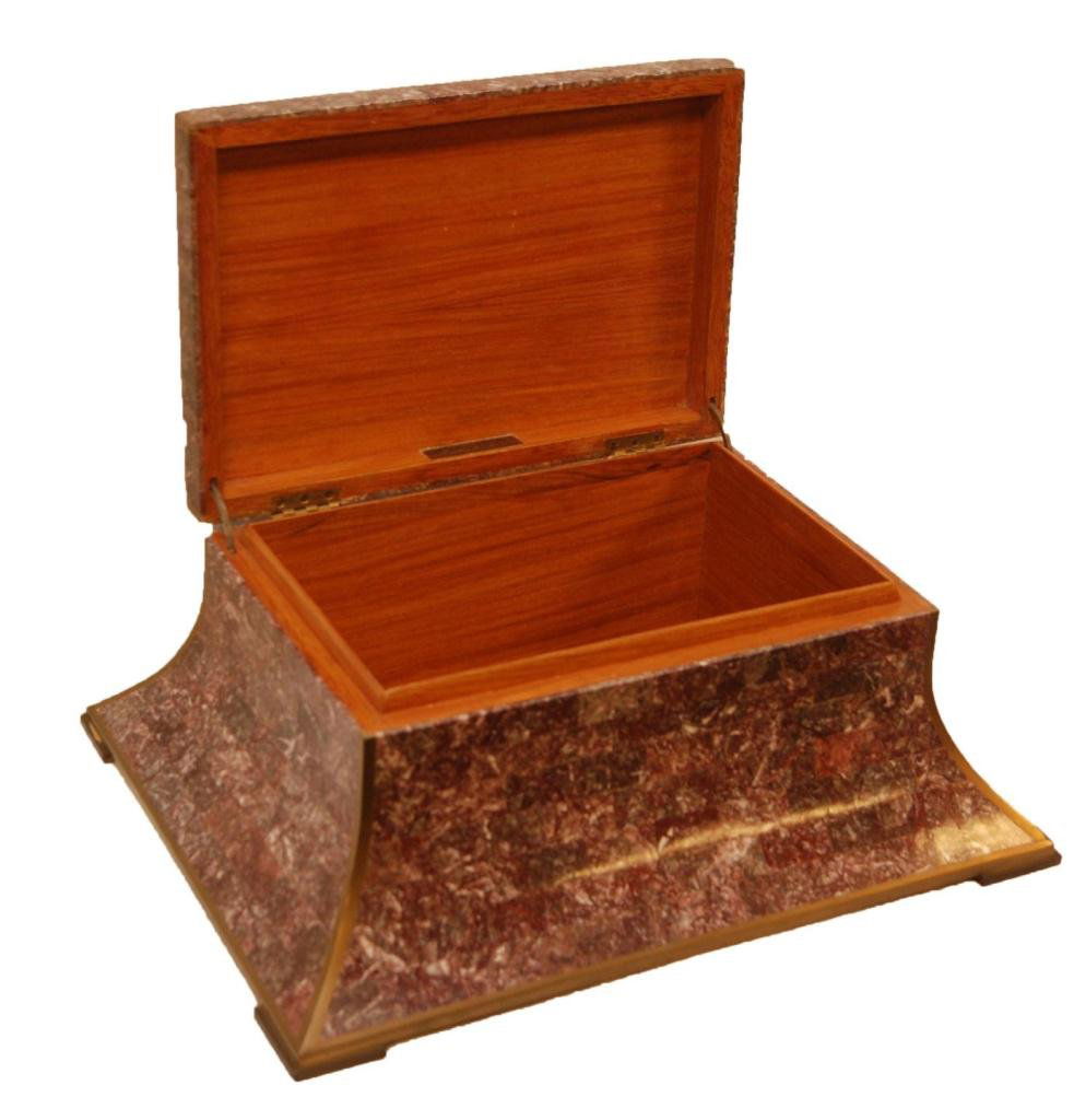 MAITLAND-SMITH TESSELLATED STONE & BRASS BOX: Maitland-Smith Home Furnishings. Hinged box in a curved plateau form comprised of intricately tessellated stone with brass inlay and feet. Has wood interior with metal maker's label to edge of lid. Me