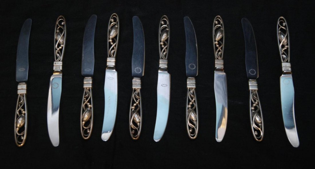 10 GEORG JENSEN DANISH STERLING HANDLED KNIVES: Lot of ten Georg Jensen Danish sterling silver knives having a figural floral reticulated design. Each marked to handle. Knives have stainless Frank Cobb English blades. Each approx. 6 7/8" length (17