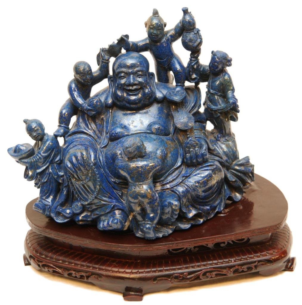 CHINESE CARVED LAPIS LAZULI HAPPY BUDDHA GROUP: Carved Chinese lapis lazuli Hotei Buddha figure group depicting a seated happy Buddha with figural Ling Zhi ruyi scepter in left hand and beaded necklace in right hand. He is surrounded by five childr